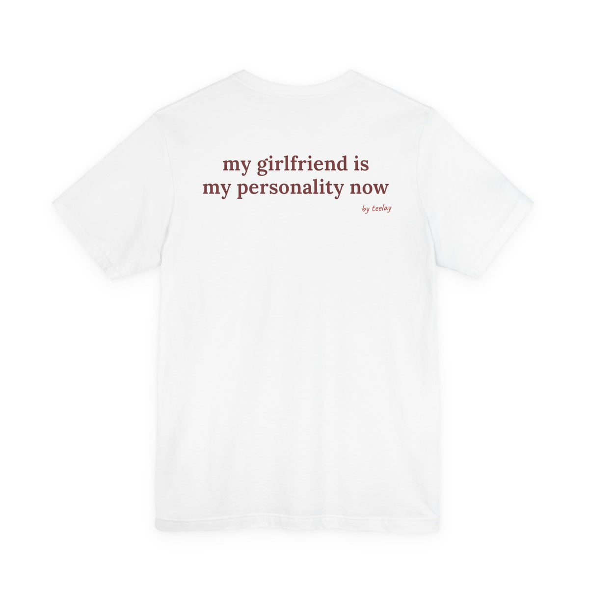 Woman from behind wearing a white oversized t shirt with "My Girlfriend Is My Personality Now" printed on the back