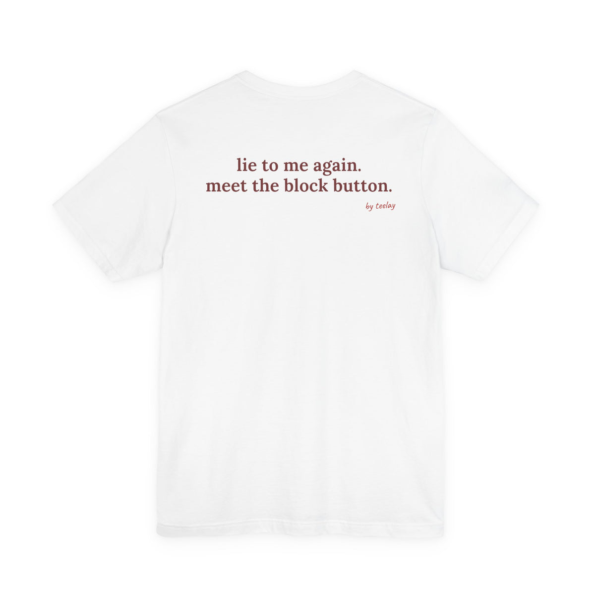Woman from behind wearing a white oversized t shirt with "Lie To Me Again. Meet The Block Button." printed on the back