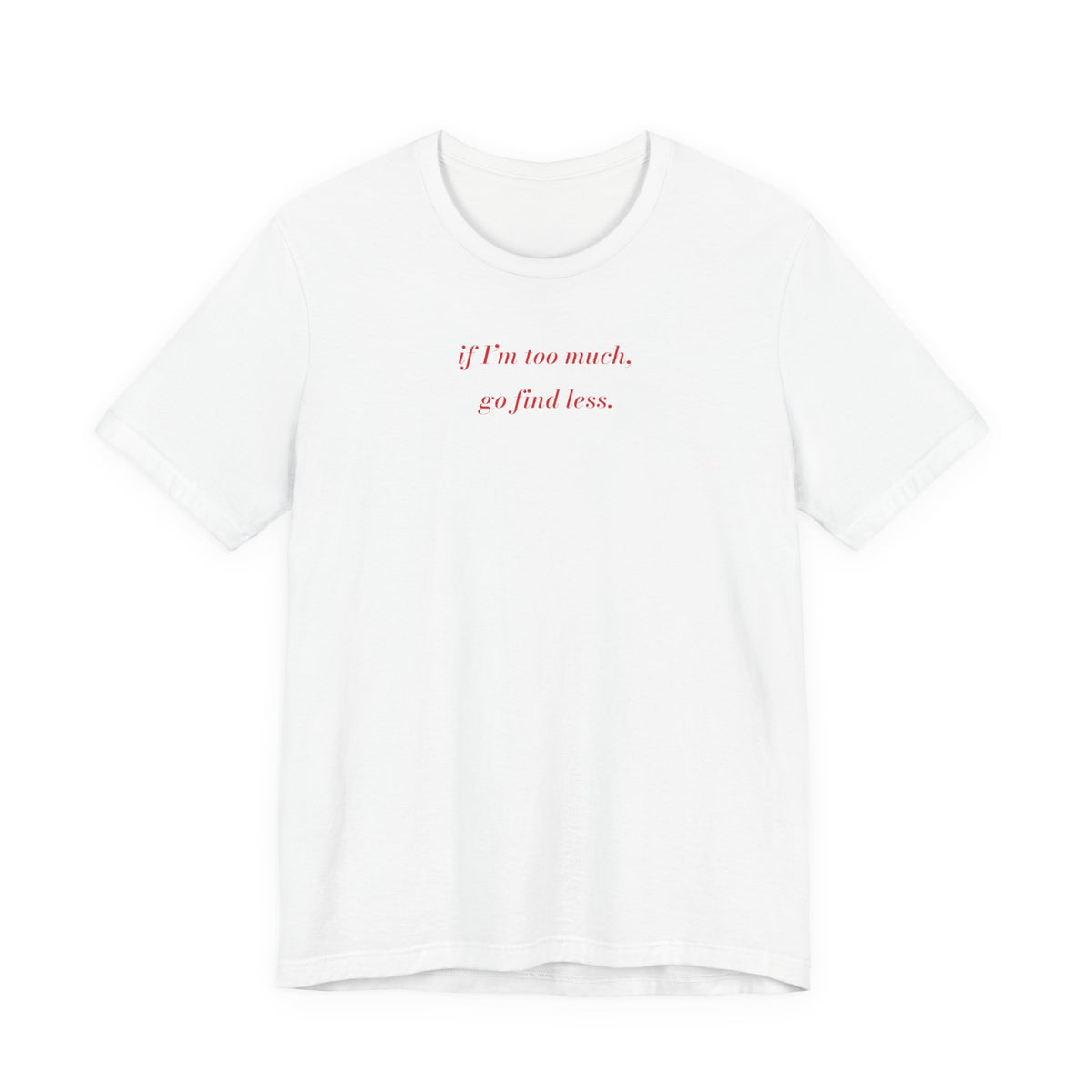 Woman wearing a white oversized t shirt with "If I'm Too Much, Go Find Less" printed on the front, fashion italic design
