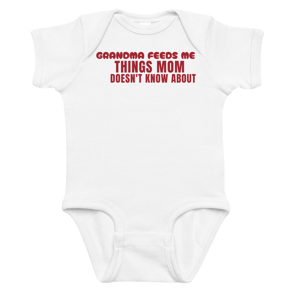 White baby bodysuit with Grandma Feeds Me Things Mom Doesn't Know About printed in red on the front