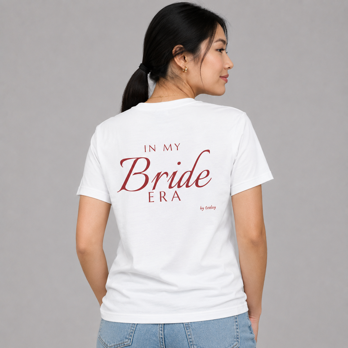 Woman from behind wearing a white t shirt with In My Bride Era printed on the back
