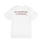 Woman from behind wearing a white oversized t shirt with "My Warmth Has A Waiting List" printed on the back
