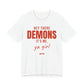White oversized t shirt with Hey There Demons, It's Me, Ya Girl printed in red on the front
