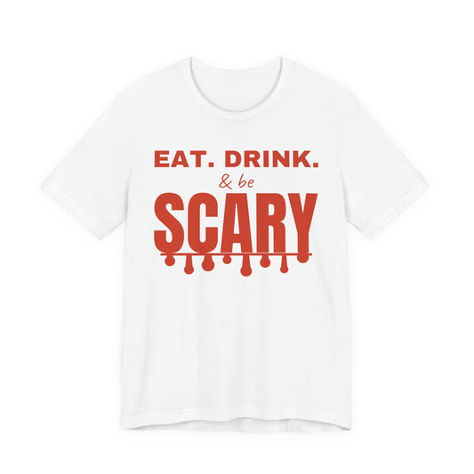 White oversized t shirt with Eat. Drink. & Be Scary printed in red on the front