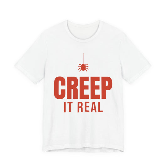White oversized t shirt with Creep It Real printed in red on the front