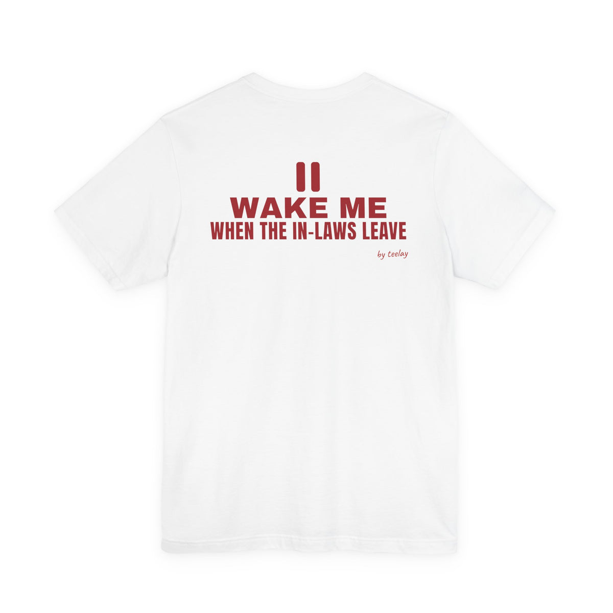 Back of a white t shirt with Wake Me When The In-Laws Leave printed in red