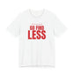 Woman wearing a white oversized t shirt with "If I'm Too Much, Go Find Less" printed on the front, big type design
