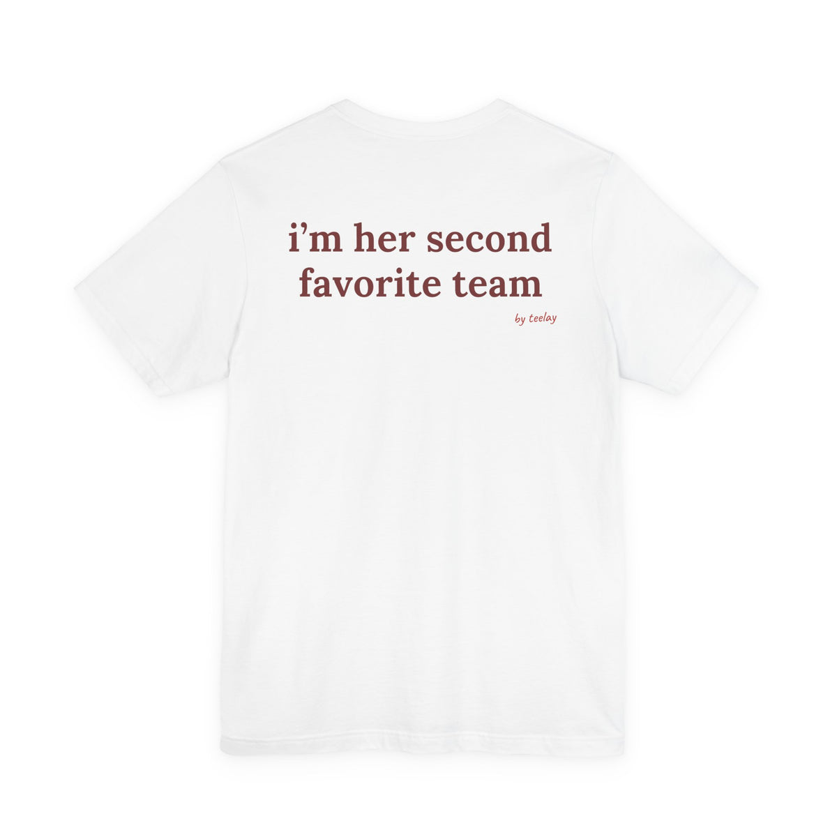 Woman from behind wearing a white oversized t shirt with "I'm Her Second Favorite Team" printed on the back