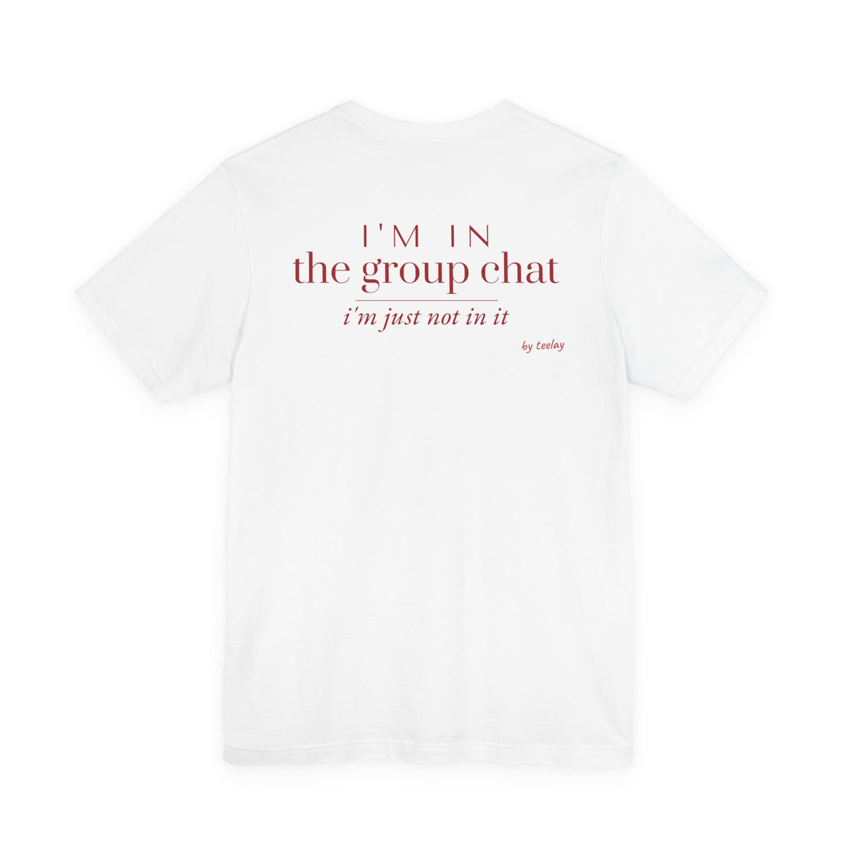 Back of a white t shirt with I'm In The Group Chat I'm Just Not In It printed in red