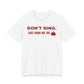 Front of a white t shirt with Don't Sing. Just Hand Me The Cake. printed in red