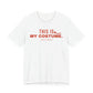 White oversized t shirt with This Is My Costume. printed in red on the front