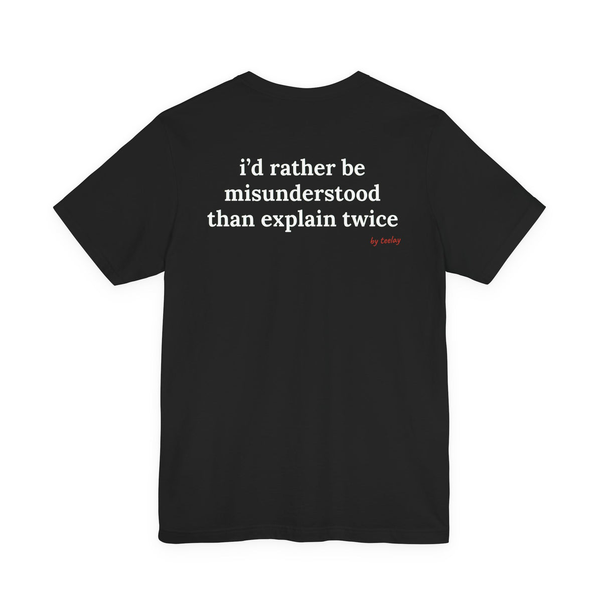 Woman from behind wearing a black oversized t shirt with "I'd Rather Be Misunderstood Than Explain Twice" printed on the back