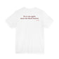 Woman from behind wearing a white oversized t shirt with "Lie To Me Again. Meet The Block Button." printed on the back