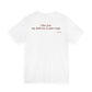 Woman from behind wearing a white oversized t shirt with "I Like You. My Delivery Is Just Tragic" printed on the back
