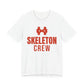 White oversized t shirt with Skeleton Crew printed in red on the front