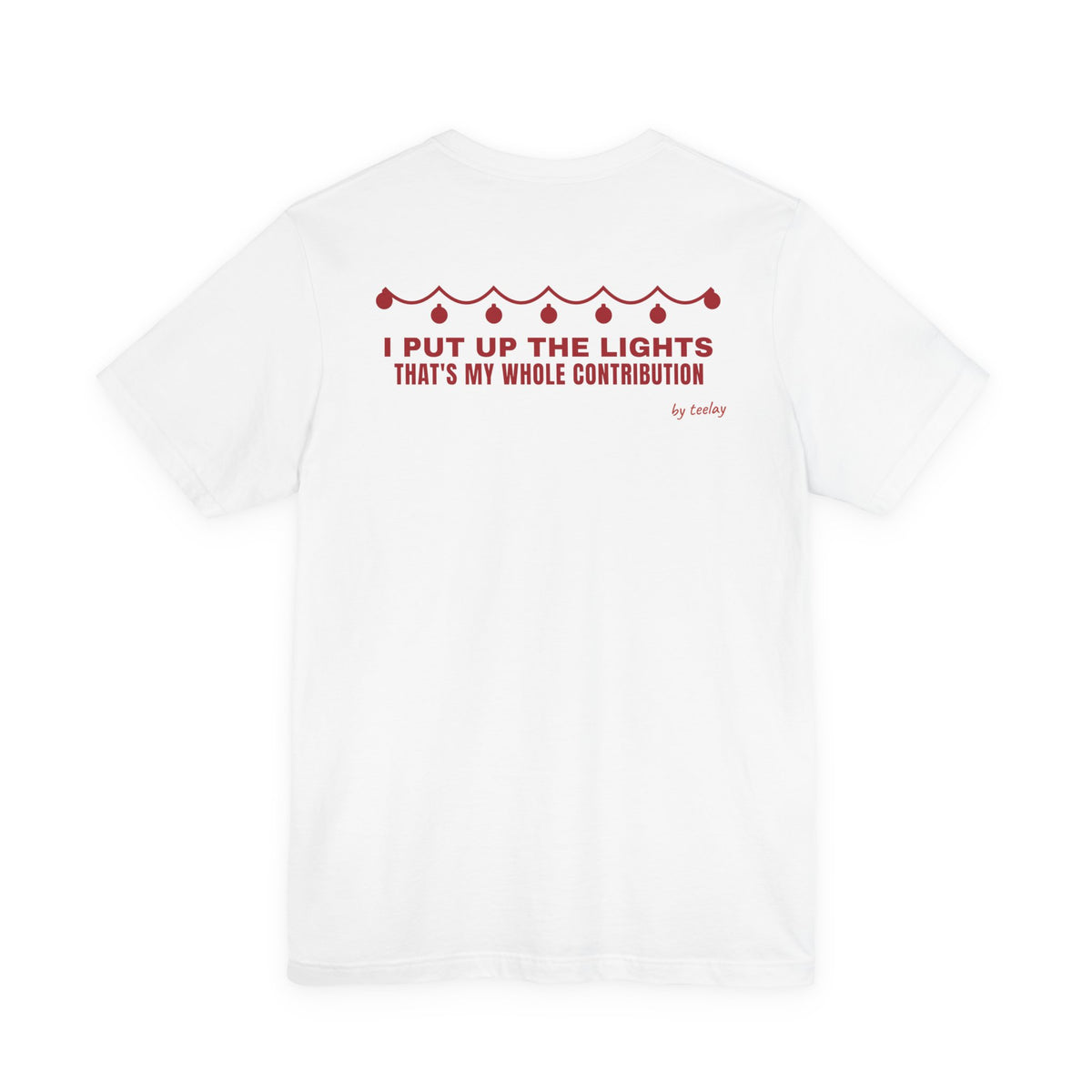 Back of a white t shirt with I Put Up The Lights That's My Whole Contribution printed in red