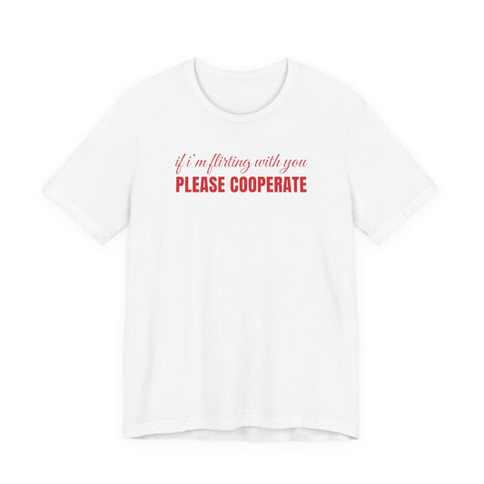 Woman wearing a white oversized t shirt with "If I'm Flirting With You, Please Cooperate" printed on the front, script print design