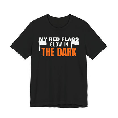 Black oversized t shirt with My Red Flags Glow In The Dark printed in orange on the front