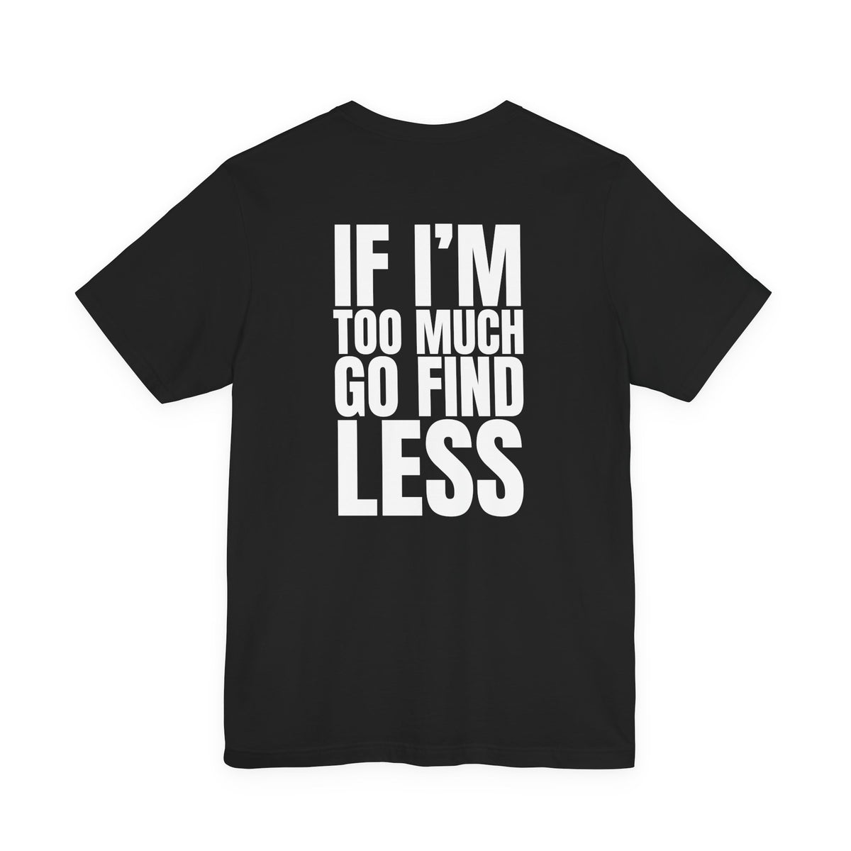 Woman from behind wearing a black oversized t shirt with "If I'm Too Much, Go Find Less" printed on the back, bold block design