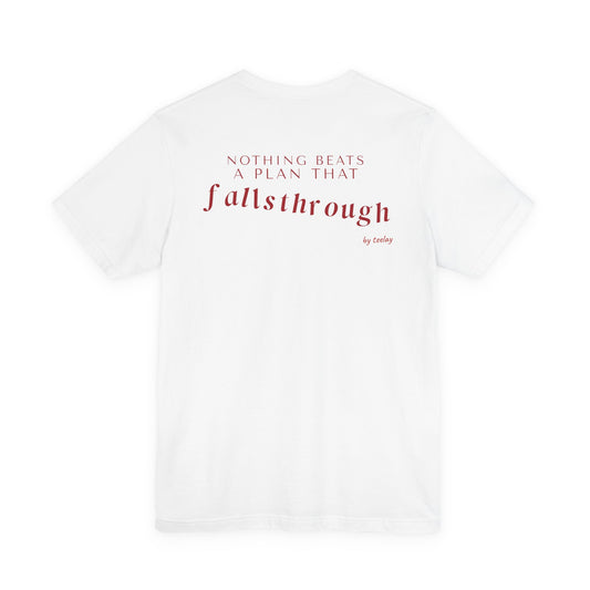 Back of a white t shirt with Nothing Beats A Plan That Falls Through printed in red