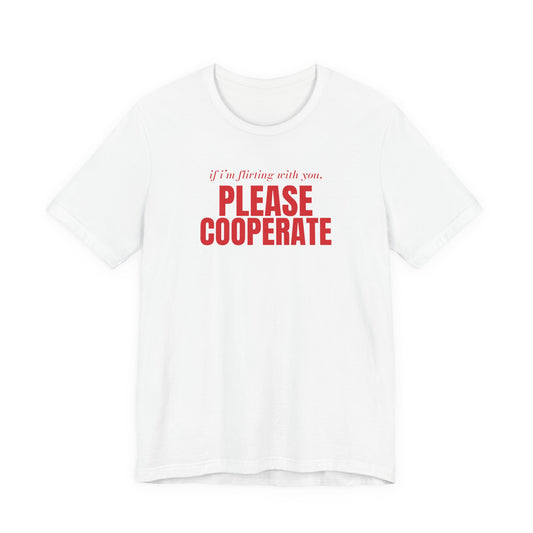 Woman wearing a white oversized t shirt with "If I'm Flirting With You, Please Cooperate" printed on the front, big type design