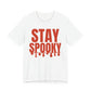White oversized t shirt with Stay Spooky printed in red on the front