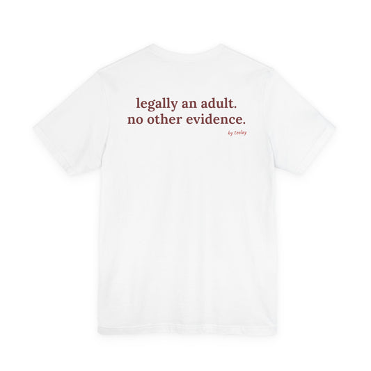 Woman from behind wearing a white oversized t shirt with "Legally An Adult. No Other Evidence." printed on the back