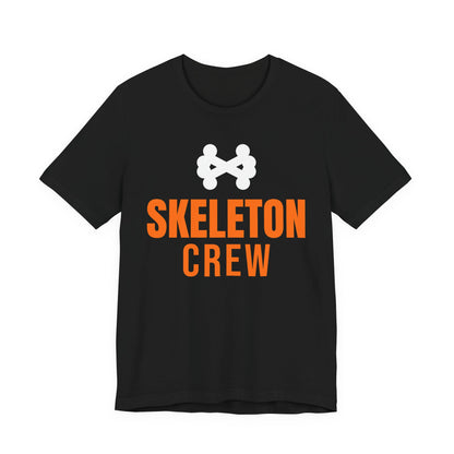 Black oversized t shirt with Skeleton Crew printed in orange on the front