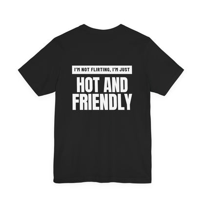 Woman from behind wearing a black oversized t shirt with "I'm Not Flirting, I'm Just Hot And Friendly" printed on the back, knockout bar design