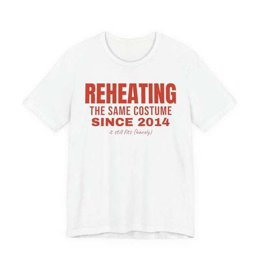 White oversized t shirt with Reheating The Same Costume Since 2014 printed in red on the front
