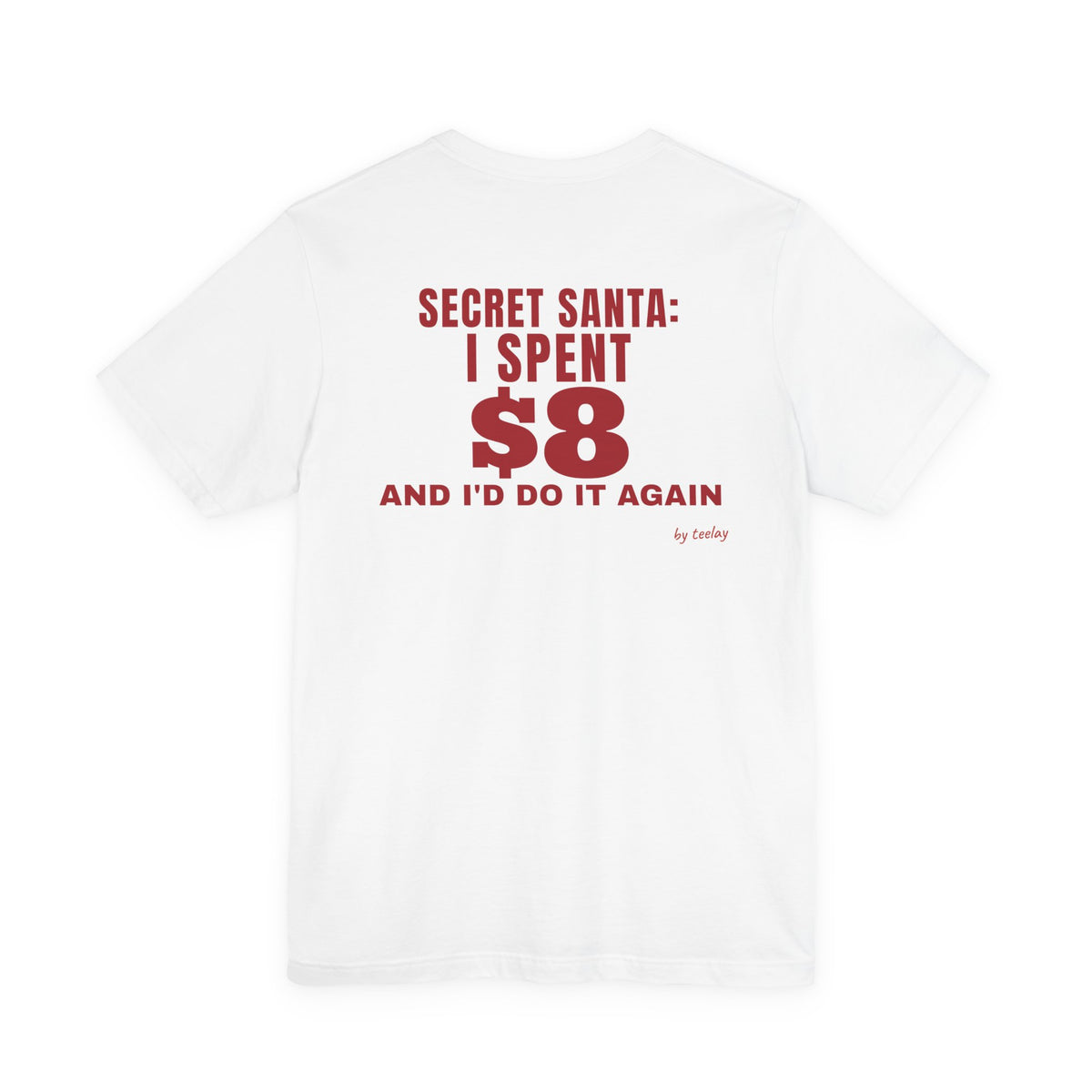 Back of a white t shirt with Secret Santa: I Spent $8 And I'd Do It Again printed in red