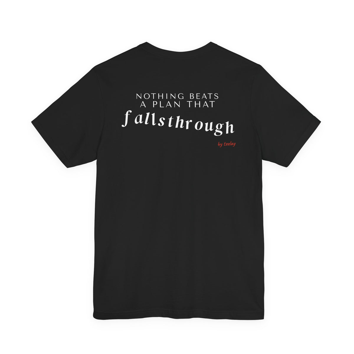 Back of a black t shirt with Nothing Beats A Plan That Falls Through printed in white