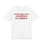Front of a white t shirt with Overstimulated. Underpaid. Still Showing Up. printed in red
