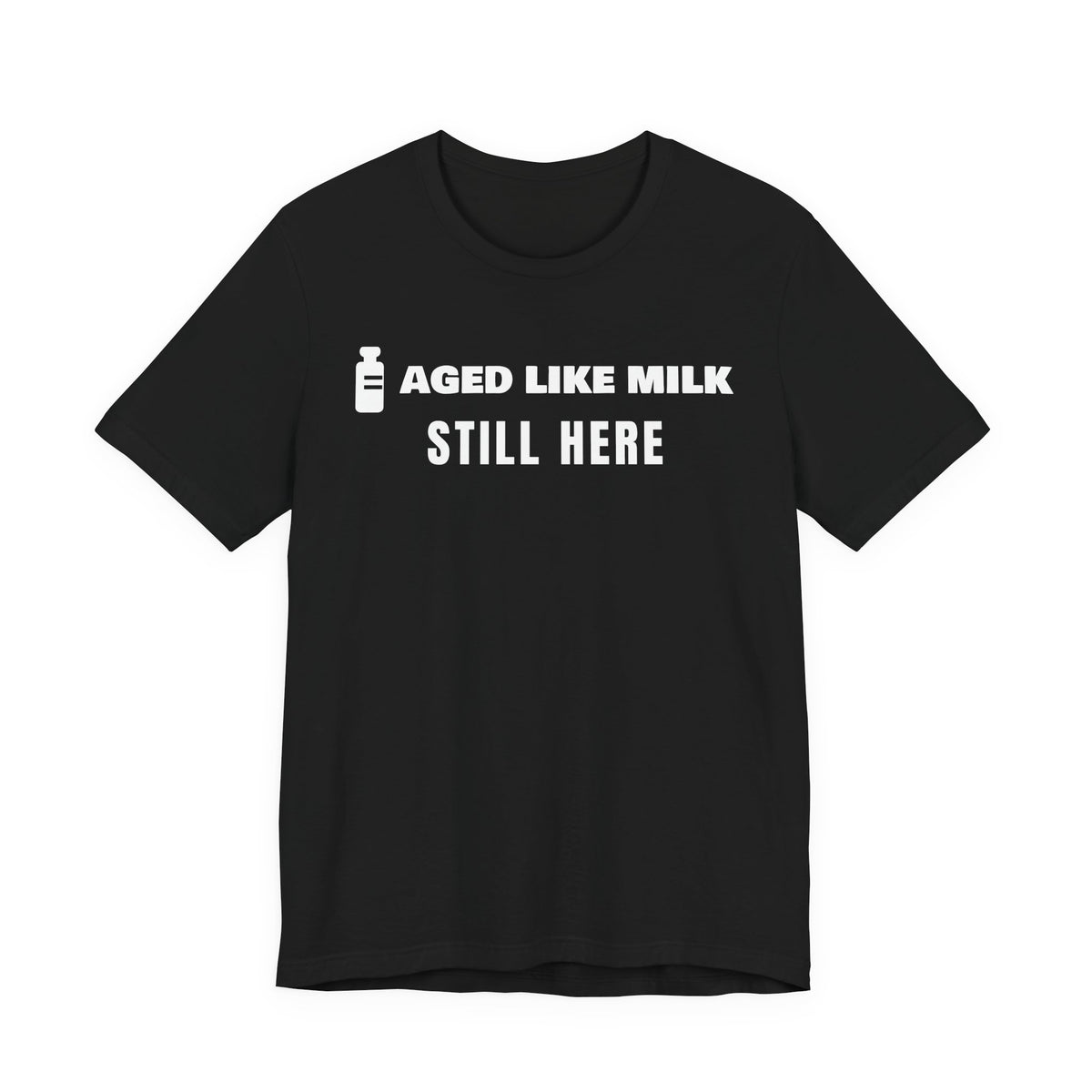 Front of a black t shirt with Aged Like Milk. Still Here. printed in white