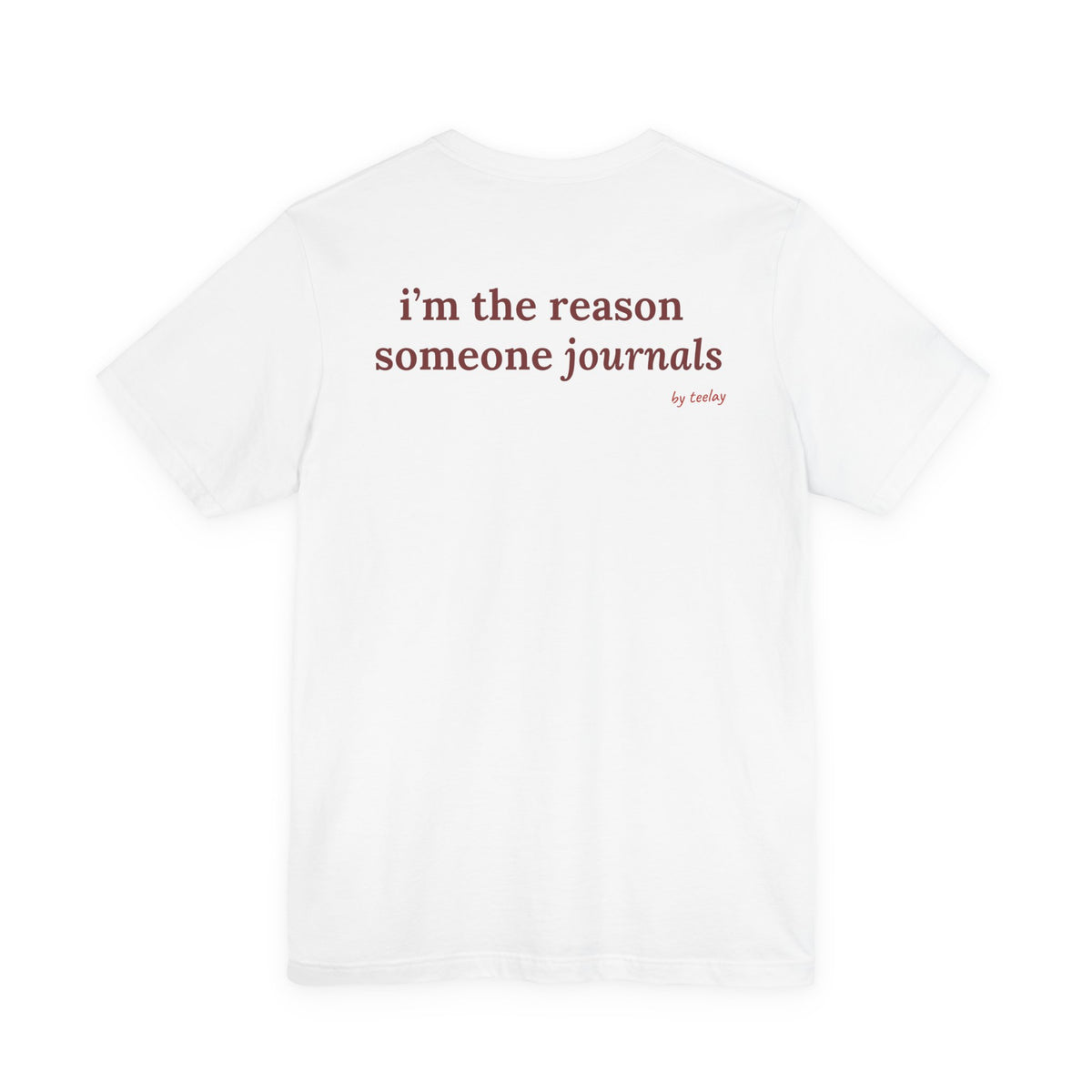 Woman from behind wearing a white oversized t shirt with "I'm The Reason Someone Journals" printed on the back