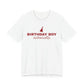 Front of a white t shirt with Birthday Boy printed in red