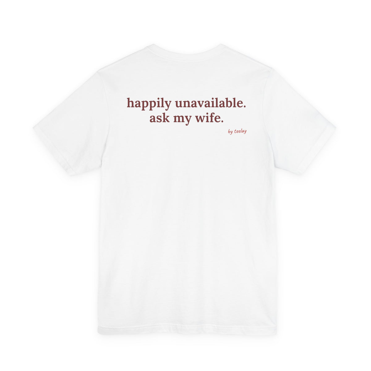 Woman from behind wearing a white oversized t shirt with "Happily Unavailable. Ask My Wife." printed on the back