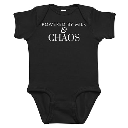 Black baby bodysuit with Powered By Milk & Chaos printed in white on the front