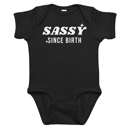 Black baby bodysuit with Sassy Since Birth printed in white on the front