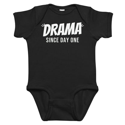 Black baby bodysuit with Drama Since Day One printed in white on the front