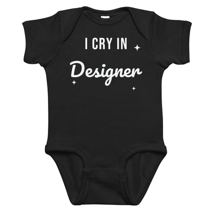 Black baby bodysuit with I Cry In Designer printed in white on the front