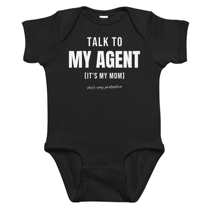 Black baby bodysuit with Talk To My Agent (It's My Mom) printed in white on the front