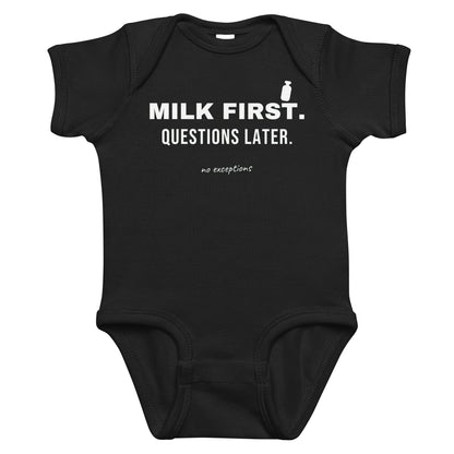 Black baby bodysuit with Milk First. Questions Later. printed in white on the front