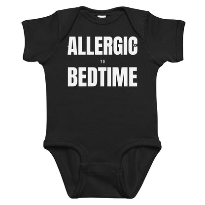 Black baby bodysuit with Allergic To Bedtime printed in white on the front