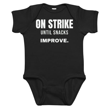 Black baby bodysuit with On Strike Until Snacks Improve printed in white on the front