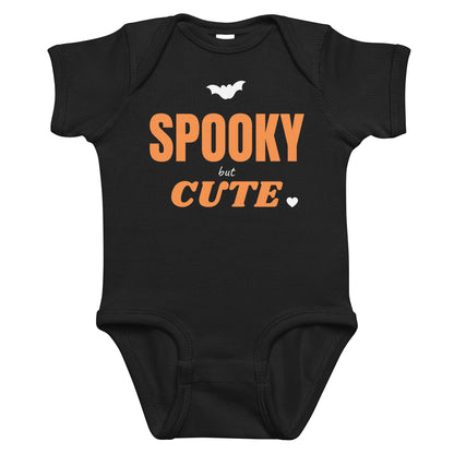 Black baby bodysuit with Spooky But Cute printed in orange on the front
