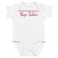 White baby bodysuit with Professional Nap Taker printed in red on the front
