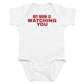 White baby bodysuit with My Mom Is Watching You printed in red on the front