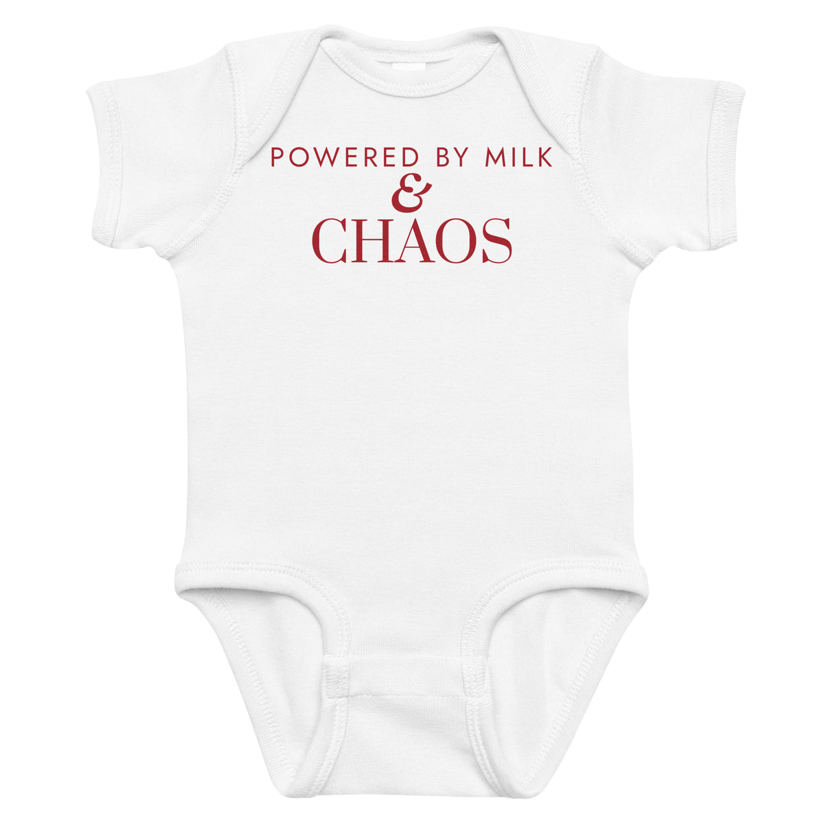 White baby bodysuit with Powered By Milk & Chaos printed in red on the front