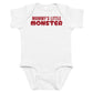 White baby bodysuit with Mommy's Little Monster printed in red on the front